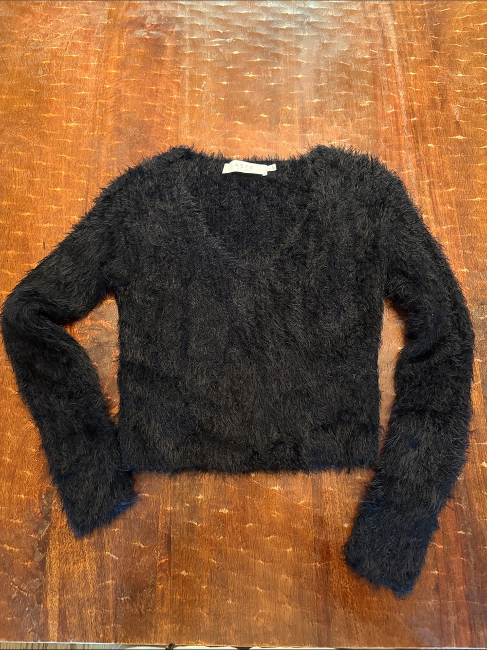 Astr Cropped Fuzzy V-Neck Sweater in Black